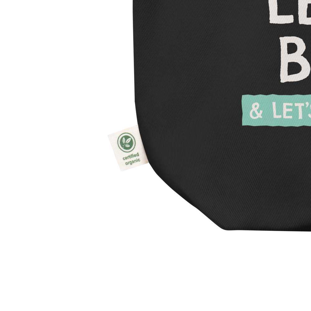 Adas-Motto-tote-bag_mockup_Product-details_Product-details_Black closeup of black tote bag showing the organic cotton hemn tag